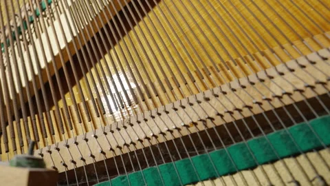 Close-Up Inside View: Upright Piano Strings and Soundboard Detail | Steel Wire Video stock 330378601