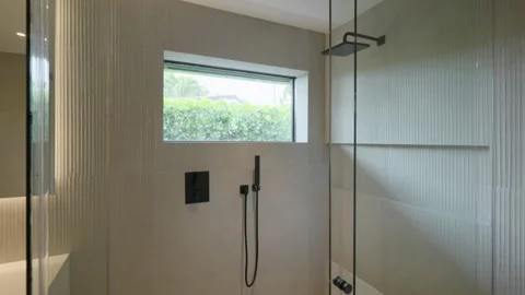 Close up inside of walk in shower cabin with corrugated walls and built in Stock Footage 282285584