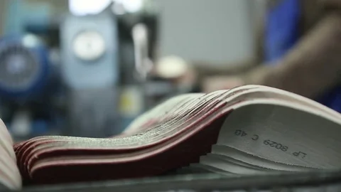 A close-up of insoles and worker in background Stock Footage 82119973