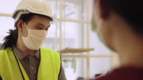 Close up inspector explain as checking with shop owner Stock Footage 132801095