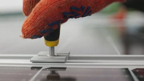 Close-up Installation, Connection and mounting of solar panels. Workers fasten Stock Footage 161173541