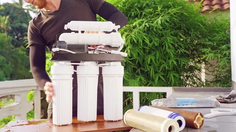 Close Up Installation of Reverse Osmosis Water Filter System on New Cartridges O Stock Footage 335234340