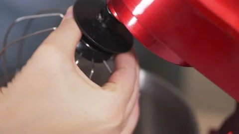 Close-up of installing a clean whisk in a red planetary mixer. Stock Footage 147577705