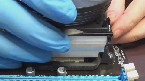 Close-up of installing a radiator on the main processor of a personal computer Stock Footage 144834970