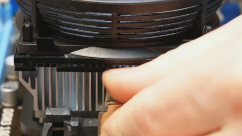 Close-up of installing a radiator on the main processor of a personal computer Stock Footage 145955268