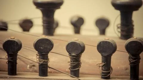 A close up of instrument string holder (1) Stock Photos