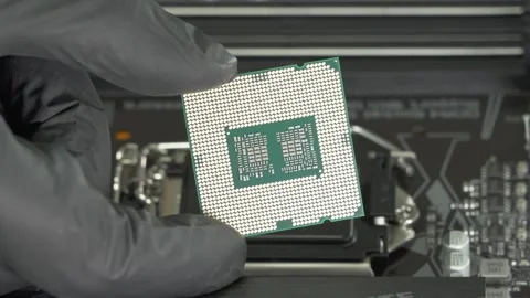 Close up Intel Central processor i9 CPU to socket 1200 Motherboard. Editorial Stock Footage 147364521