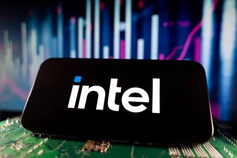 Close up of Intel logo on smartphone screen with technology and financial chart Stock Photos