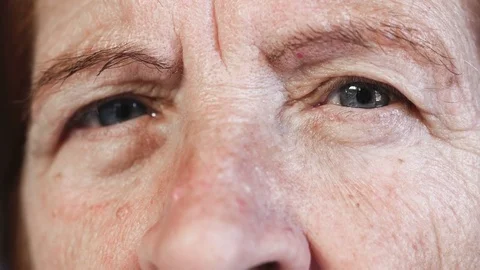 Close up on intense look of sad old woman Stock Footage 74717087