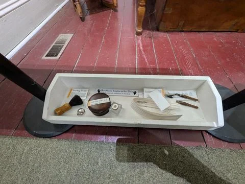 Close-up of an interactive museum learning box containing vintage objects Stock Photos