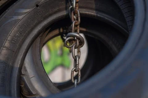 Close-Up of Interconnected Tires and Chain Highlighting Texture and Urban E.. Stock Photos