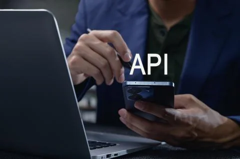 Close-Up of Interface Programming with Smartphone and Laptop Display 写真素材