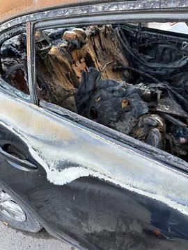 A close-up of the interior of a burnt car Stock Photos