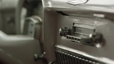 Close-up of an interior car dashboard with a Cadillac radio controller Stock Footage 202898400