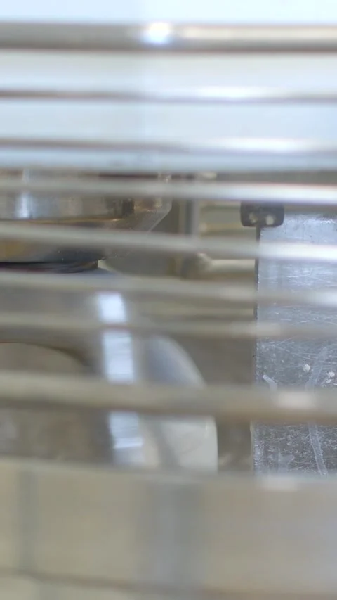 Close interior view through metal grill revealing stacked components and gasket Stock Footage 345601529