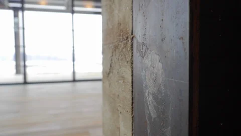 Close-up of interior wall of exposed concrete in modern home. Video stock 98013726