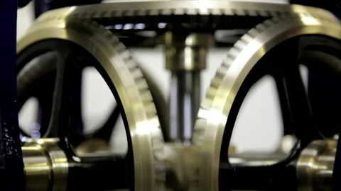 Close-Up of Interlocking Brass Gears Turning in Clockwork Mechanism Stock Footage 345752629