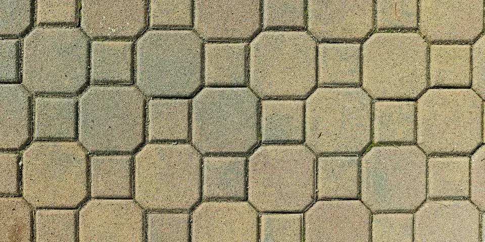 Close-up of interlocking stone tiles forming an intricate geometric pattern Stock Photos