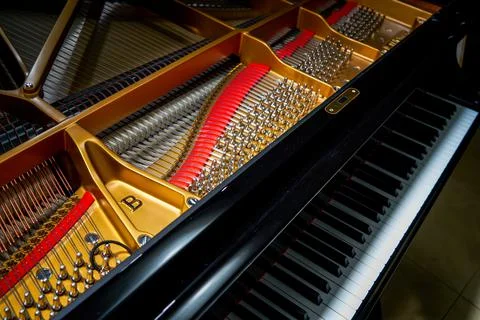 A close-up of the internal string structure of a top grand piano Foto stock