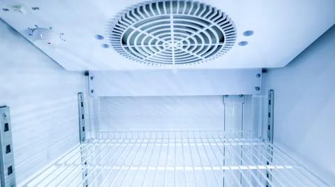Close up internal view looking up at the cooling fan system and top shelf o.. Stock Photos