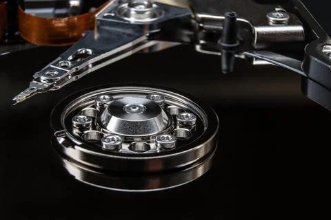 Close-up of the internals of a hard drive. Rotating hard disk platters and da Stock Photos