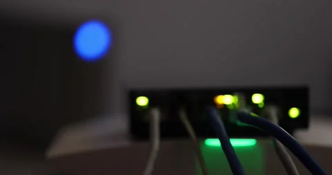 Close-up internet network switch plugged ethernet cables connected to simple hom Stock Footage 177373960