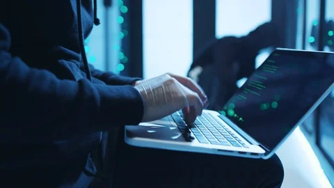 Close-up internet spy with laptop typing code in malware trying to break a Stock Footage 120604831
