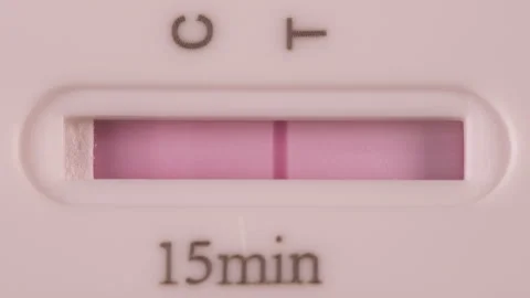 Close up of an Invalid COVID-19 (Corona) Rapid Antigen Test in a few seconds Stock Footage 156300590