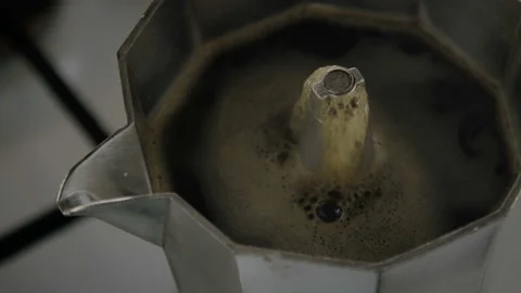 Close-up of an invigorating hot drink flowing from the nozzle of a geyser coffee Stock Footage 105342824