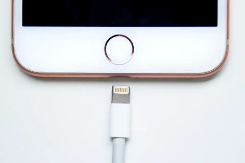 Close up of an iPhone and a Lightning to USB Cable Stock Photos