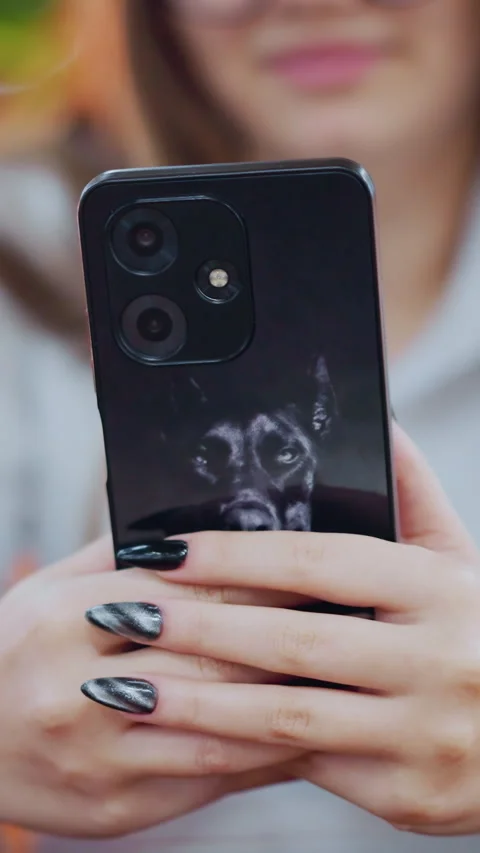 Close-up of iPhone with Donkey Sticker Operated by Owner with Blurred Background Stock Footage 318835660