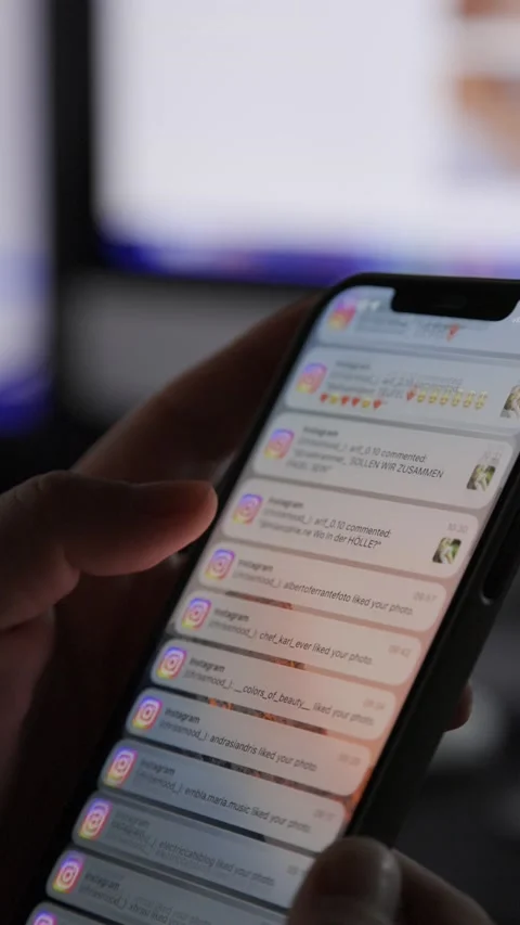 Close up of iPhone screen with Male Hand scrolling Instagram Notification Stock Footage 209263997
