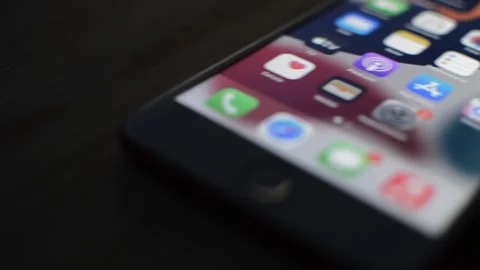 Close-up iphone touch screen on a dark background. iphone by apple screen. 스톡 동영상 231119608