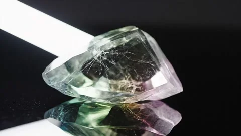 Close-Up of Iridescent Gemstone on Black Background Stock Footage 324809079