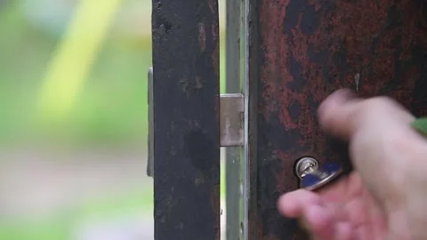 Close the iron gate lock Stock Footage 258074964