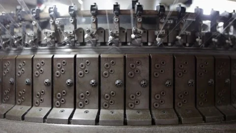 Close up of iron industrial loom machine weaving white cotton yarn in factory Stock Footage 149071615
