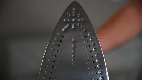 Close up of ironing tool on white background Stock-Footage 106796170