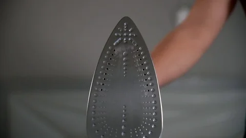 Close up of ironing tool on white background Stock-Footage 106796178