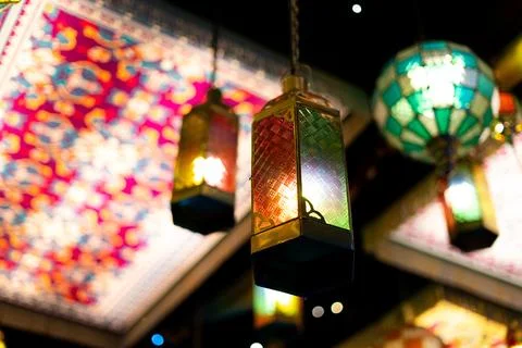 Close-Up Islamic Lanterns with Colorful Patterned Panels Above Stock Photos