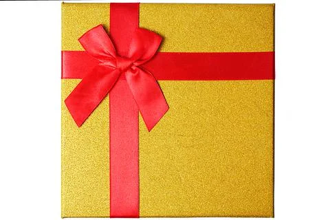 Close up isolate of gift golden box with red ribbon Stock Photos