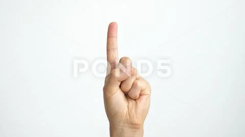 Close up of isolated female hand shows index finger up isolated on white Stock Photos