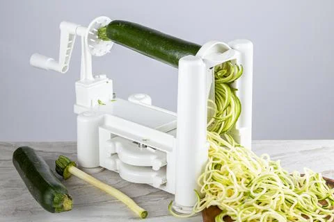 Close up isolated image of a plastic hand operated vegetable slicer, spiraliz Stock Photos