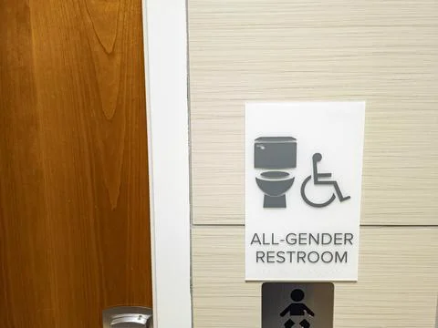 Close up isolated image showing all gender restroom sign at the entrance of a Stock Photos