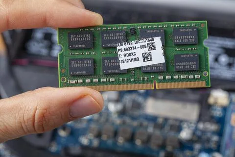 Close up isolated image showing an it technician or a consumer holding ram ca 写真素材