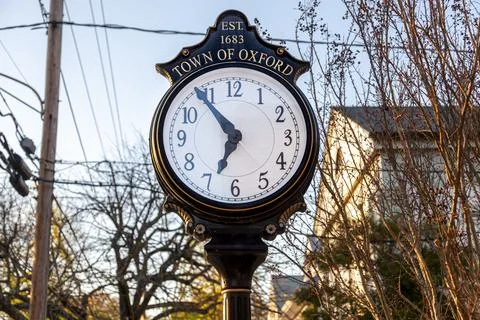 Close up isolated image of a stand alone vintage clock in the town center of  Fotos de archivo