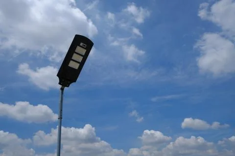 Close up isolated LED lamppost with bright cloudy sky Stock Photos