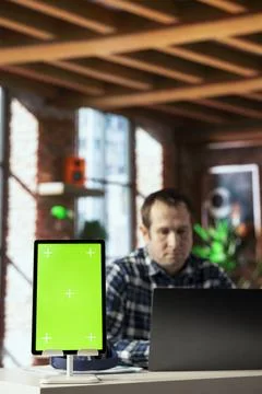 Close up of isolated screen tablet used by worker in home office analyzing data Stock Photos