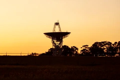 Close up isolated silhouette image of a large radio telescope antenna Stock Photos