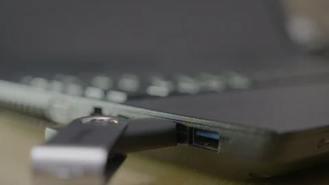 Close up of an IT business man hands installing drivers using usb data stick  Stock Footage 87014375