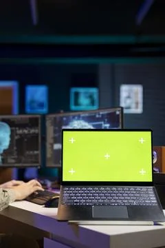 Close up of IT expert using programming to upgrade AI on mockup notebook Stockfoto's